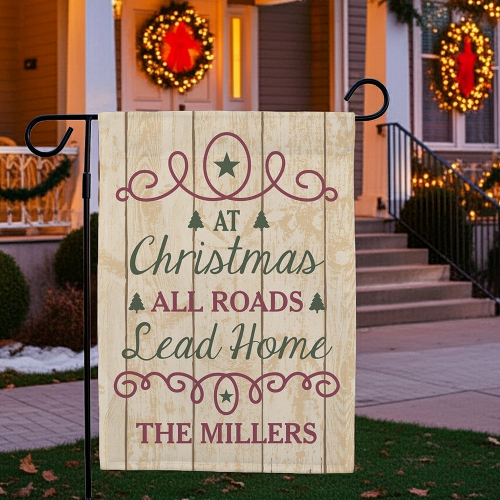 Christmas garden flag featuring a warm holiday greeting for the Millers with decorative pine trees