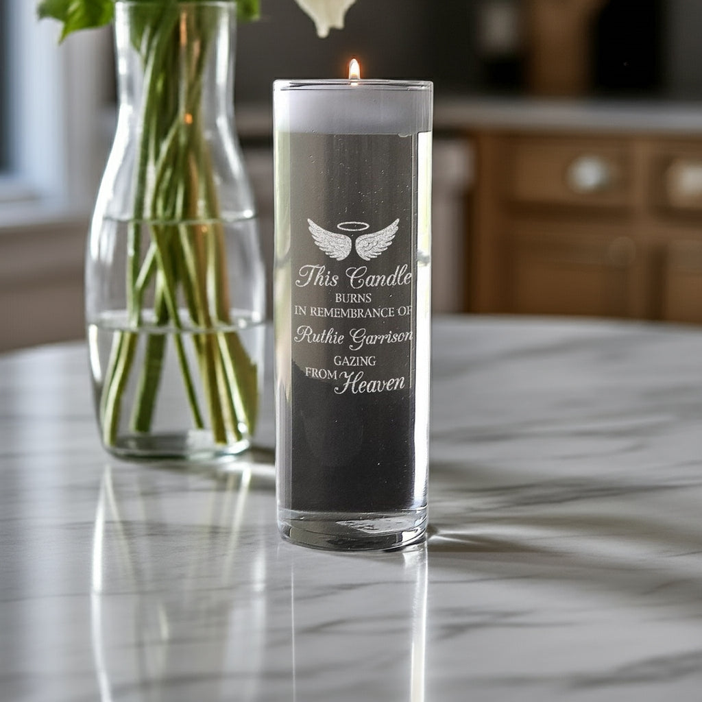 Angel Wings Personalized Memory Candle Vase with engraved remembrance message burning on kitchen marble countertop