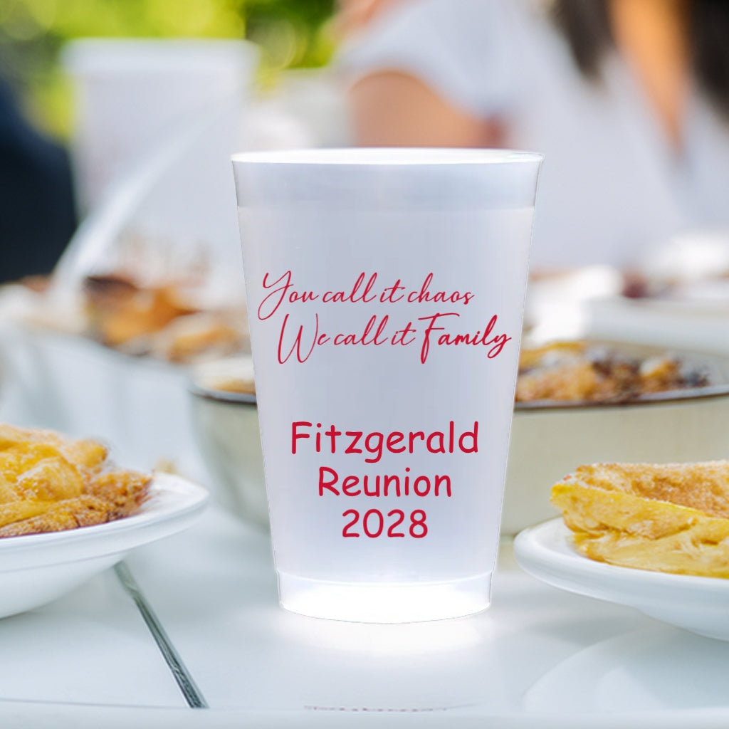 Clear personalized family reunion cups with red text Fitzgerald Reunion 2028 on picnic table