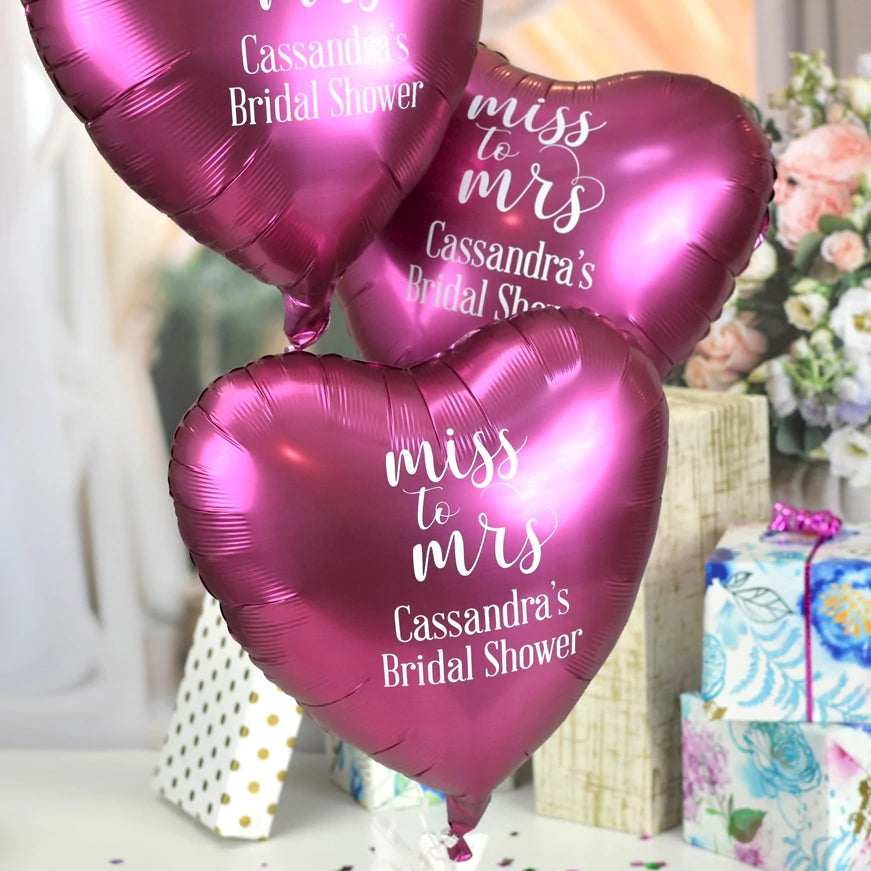 Luxe pomegranate color heart shape wedding balloons personalized with miss to mrs design and text in white print for bridal shower decorations