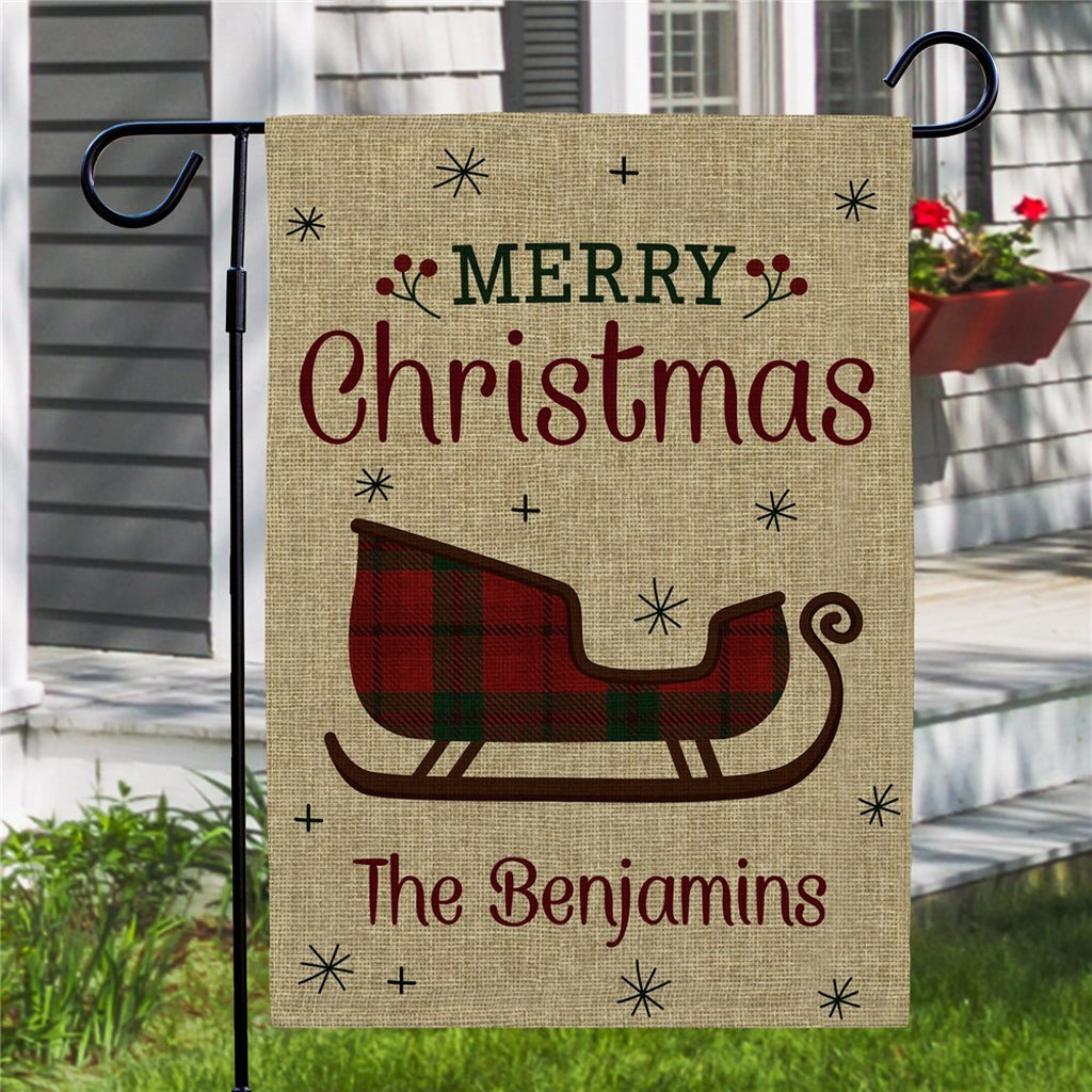 Merry Christmas garden flag featuring a sleigh design and customizable name for festive decoration