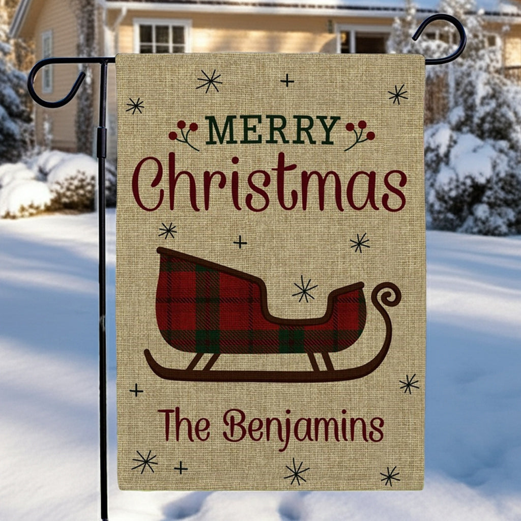 Christmas garden flag featuring a sleigh design and personalized text for festive outdoor decoration