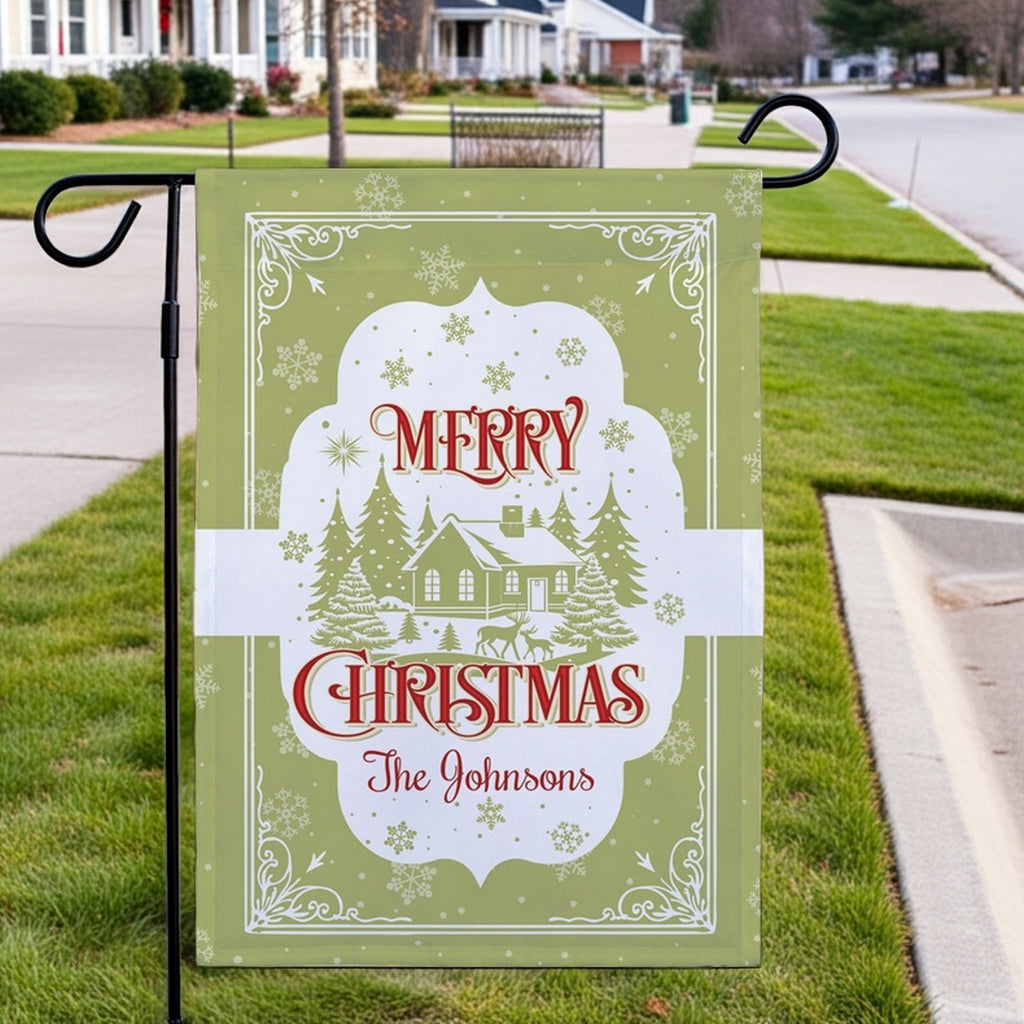 Merry Christmas garden flag featuring a snowy house and trees, personalized for The Johnsons