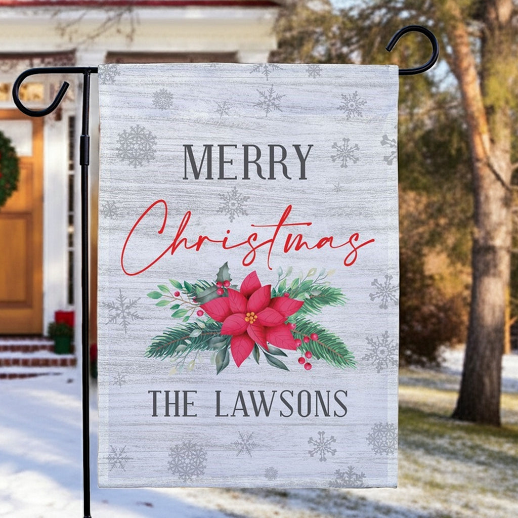 Christmas garden flag featuring a festive design with poinsettias and personalized text for the Lawsons