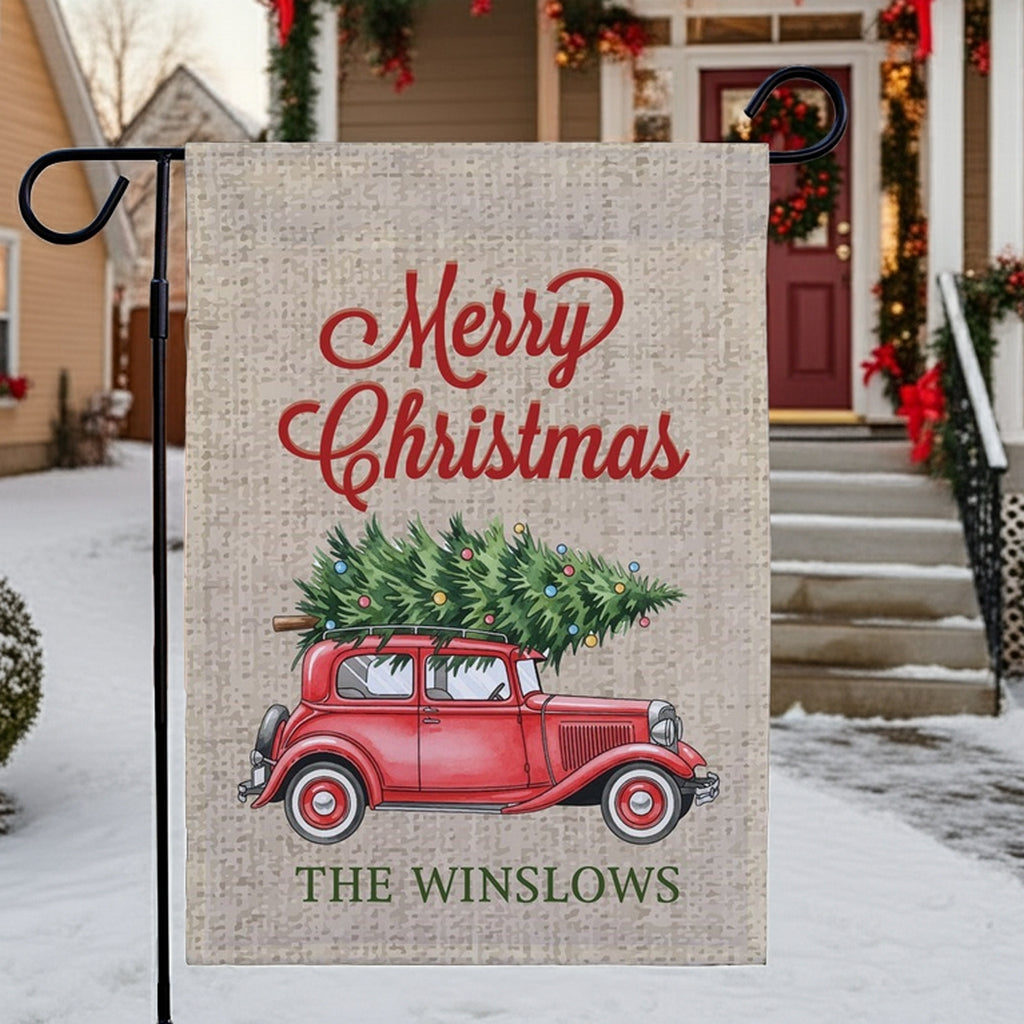 Christmas garden flag featuring a red car with a Christmas tree and the text Merry Christmas The Winslows