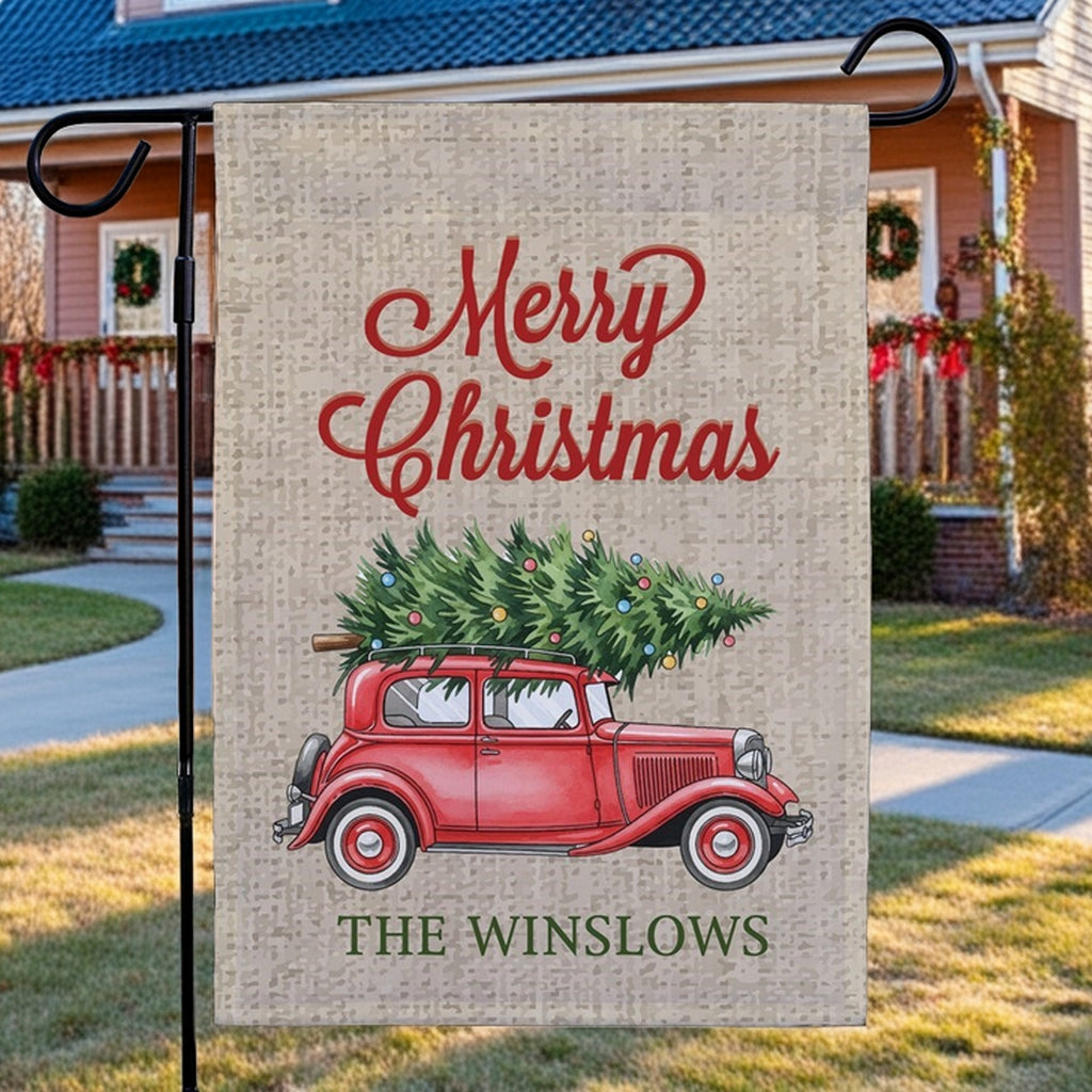 Christmas garden flag featuring a vintage red car and 'Merry Christmas' design