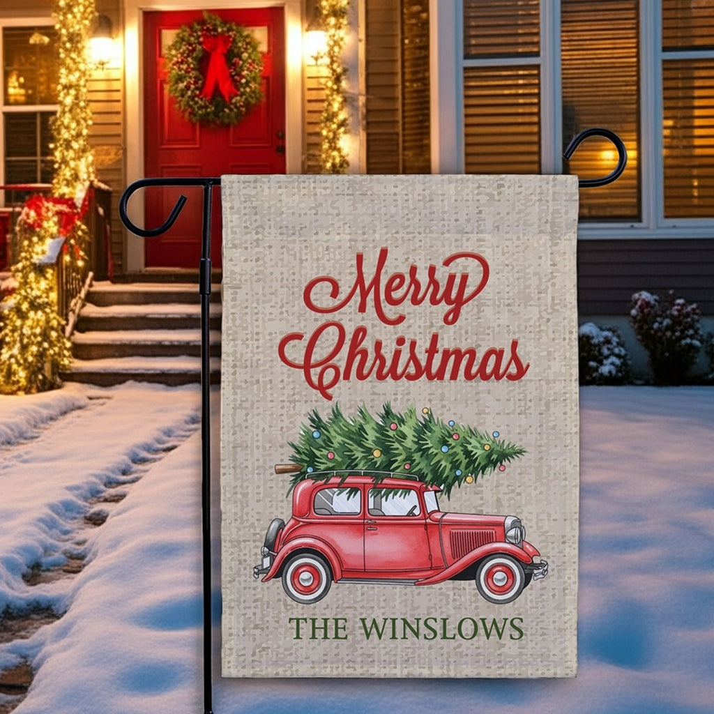 Christmas garden flag featuring a red vintage truck with a Christmas tree and the text Merry Christmas