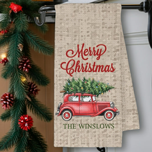 Personalized Christmas kitchen towel featuring a vintage red car with a Christmas tree and text Merry Christmas The Winslows
