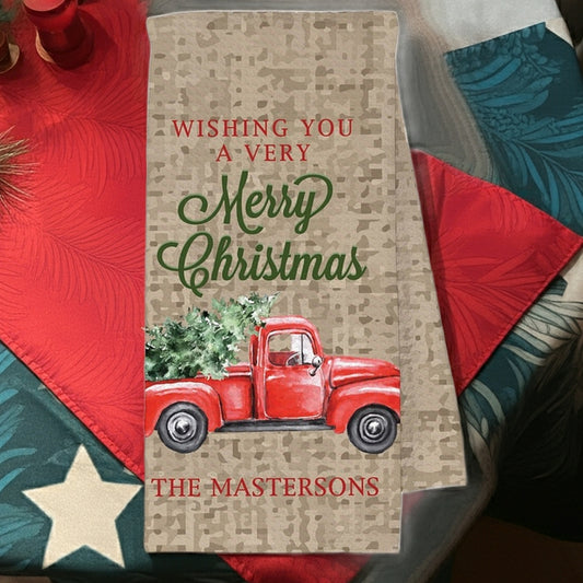Christmas kitchen towel featuring a red vintage truck with Merry Christmas design