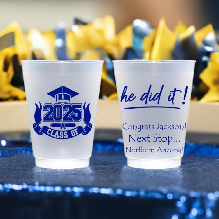 Two 16 oz personalized frosted graduation party cups with blue 2025 class design and custom congratulatory text