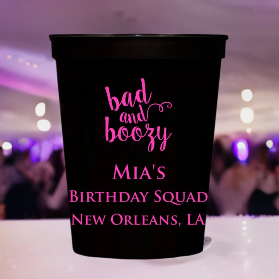 black 16 oz. stadium cup personalized with bad and boozy adult birthday design and custom text in silver print