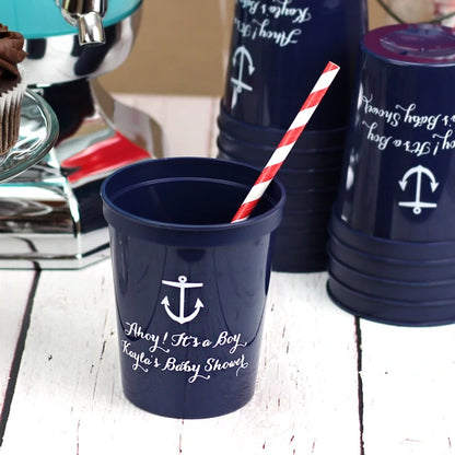 Navy 16 oz. reusable baby shower cups personalized with anchor design and two lines of custom text in white print