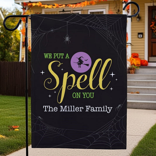 Custom printed Halloween garden flag black with witch silhouette purple circle spiderweb accents and The Miller Family name