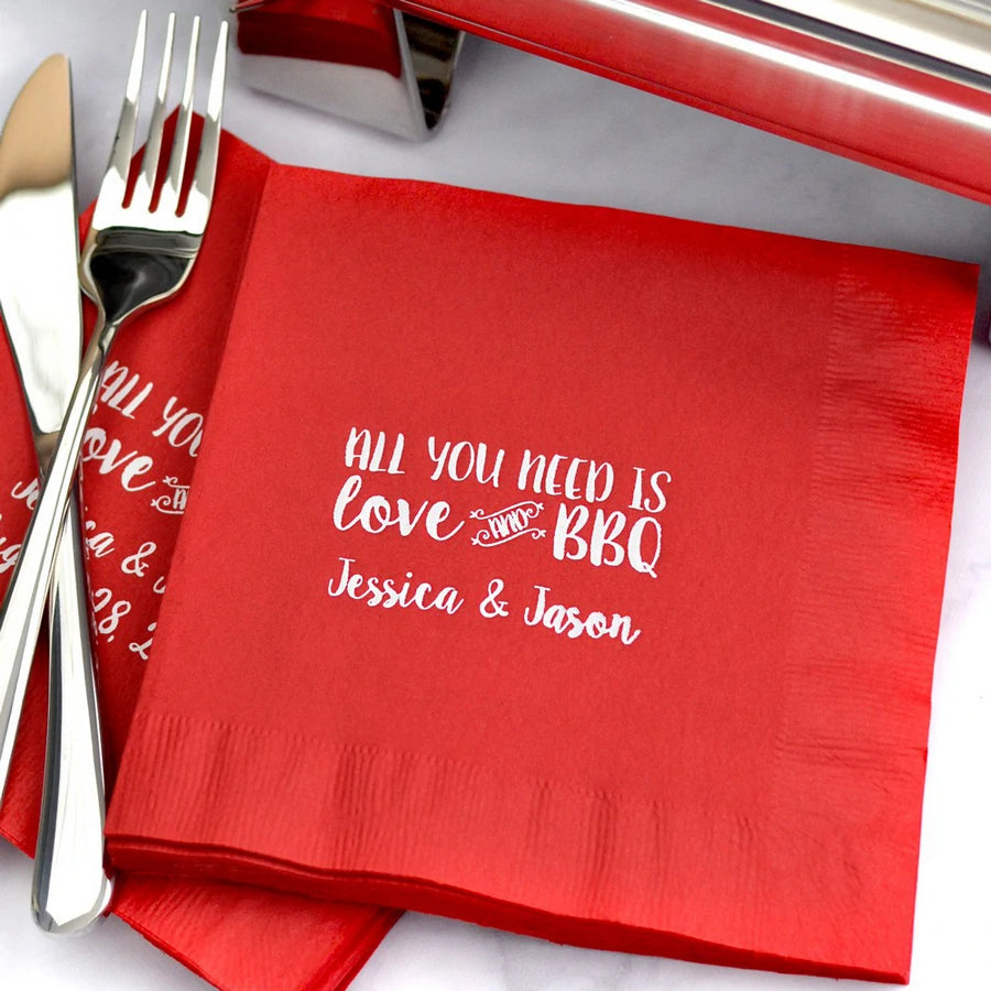 Red wedding luncheon napkins personalized with all you need is love and bbq design and bride and groom name in white print