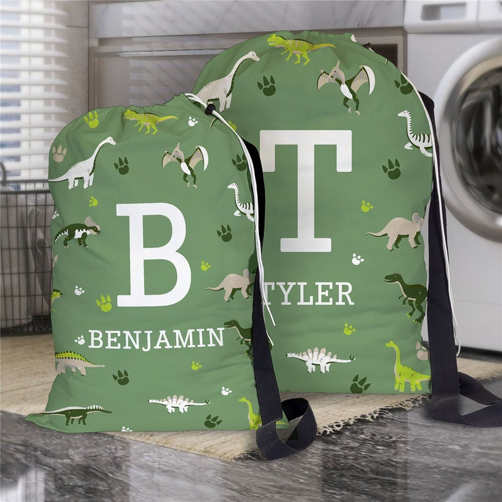 Regular and large size dinosaur print laundry bags personalized with large bold initial and name for dinosaur gifts for kids and adults