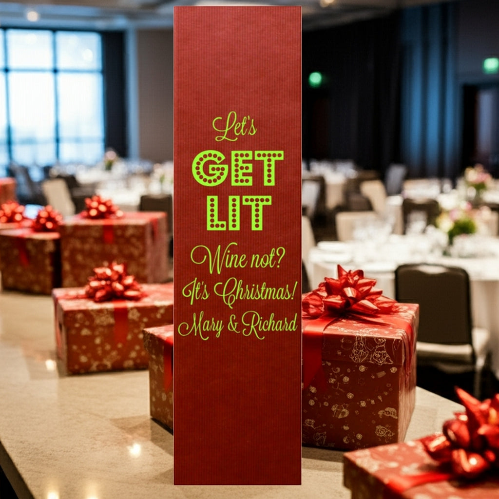 Tippytoad red Christmas wine bottle bag with green text among gifts foil stamped personalized Christmas wine bottle gift boxes