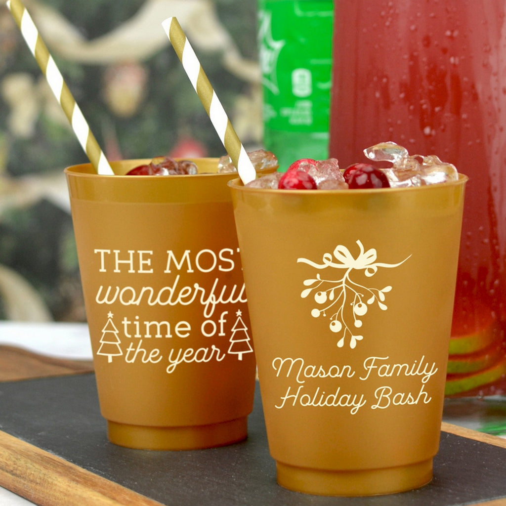 Frosted plastic Christmas party cups featuring festive designs for holiday celebrations