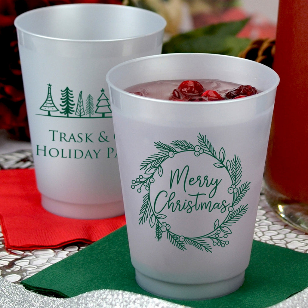 Frosted plastic Christmas party cups with festive designs for holiday celebrations