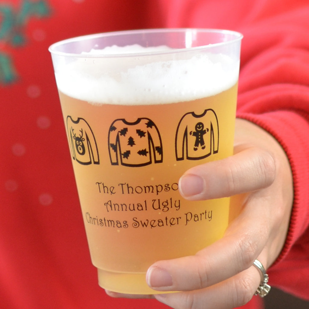 Frosted plastic Christmas party cups featuring fun holiday designs for festive gatherings