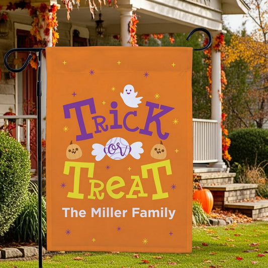 Halloween garden flag personalized with orange Trick or Treat design and ghost candy pumpkins The Miller Family
