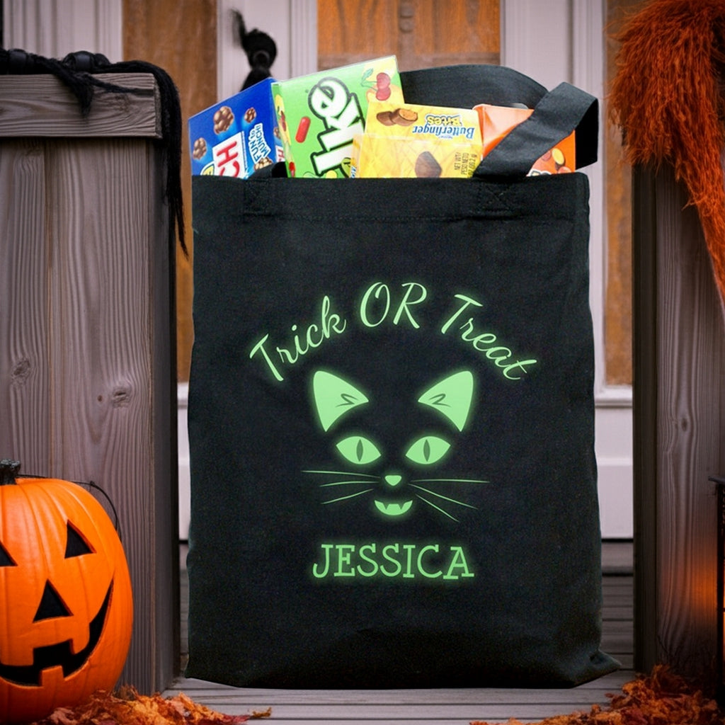 Black canvas glow in the dark cat personalized trick or treat bag with neon green cat face and name Jessica