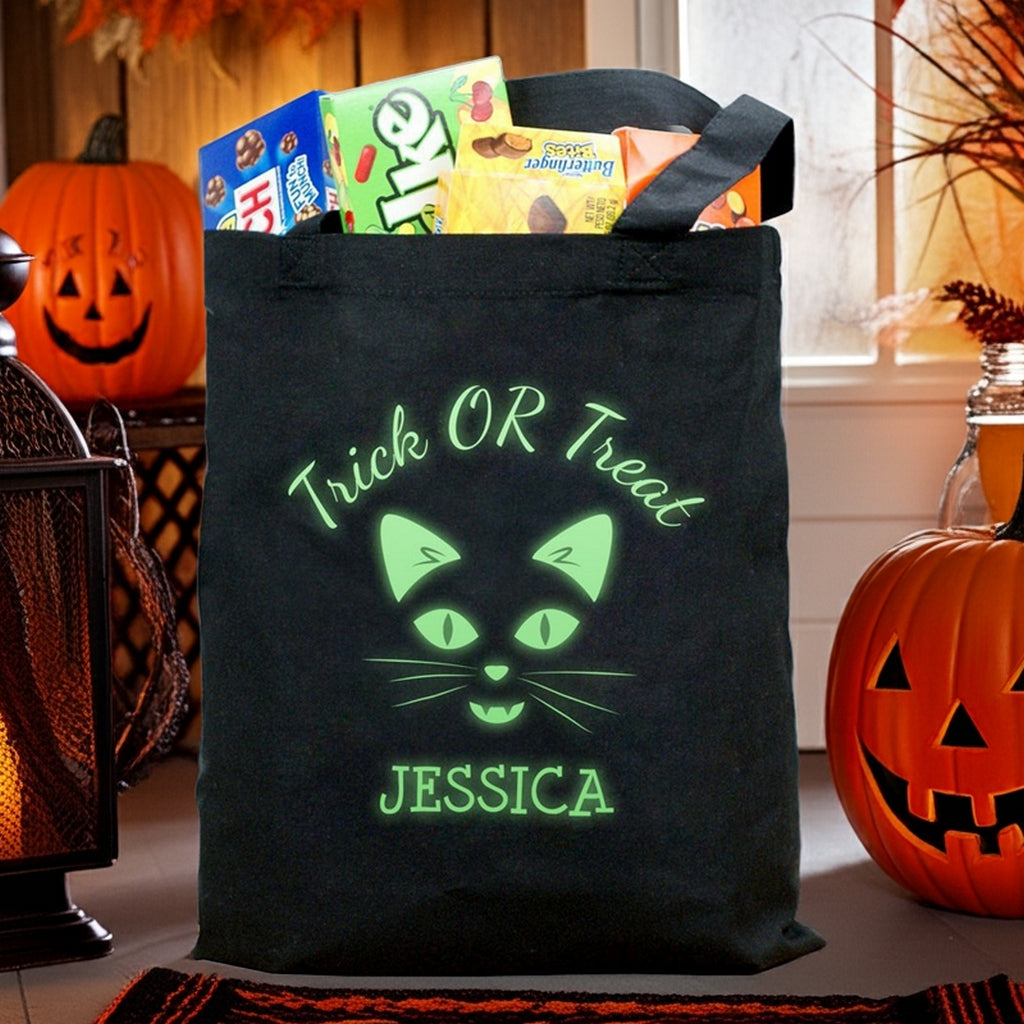 Tote featuring glow in the dark cat personalized trick or treat bag with green cat face