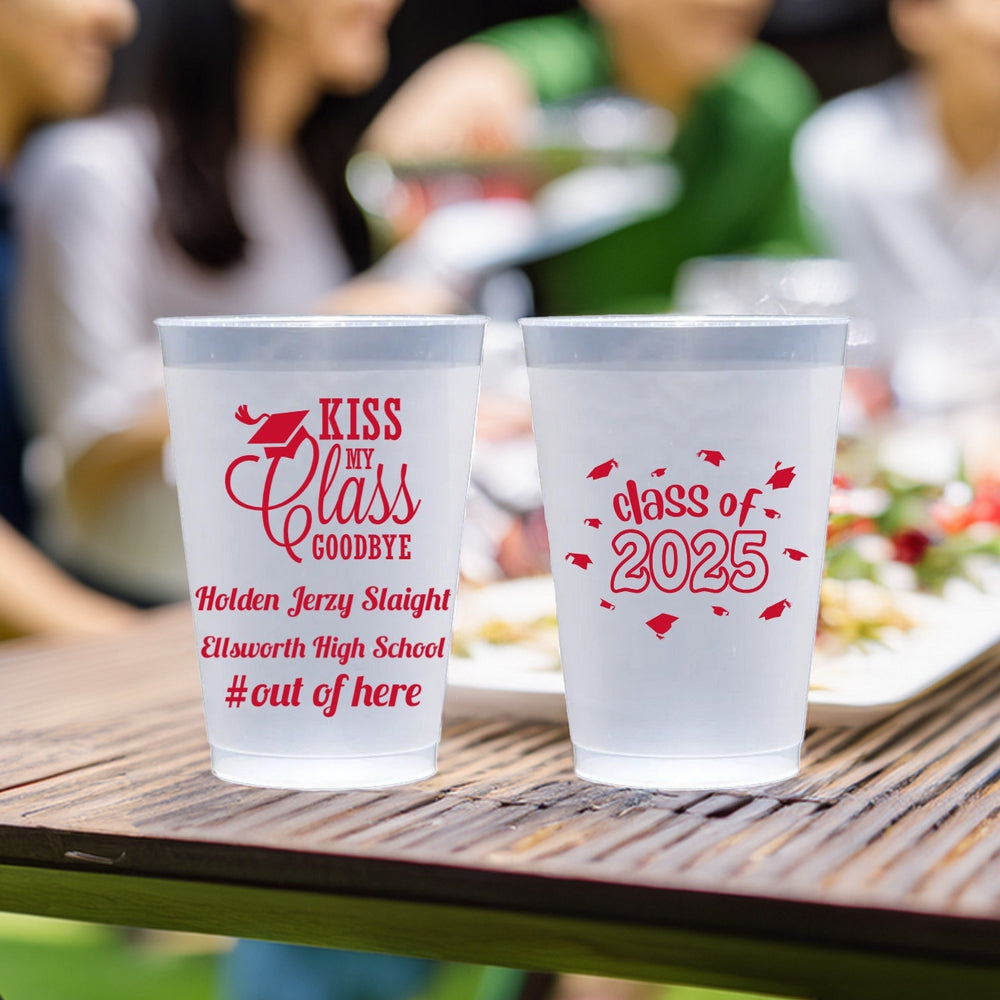 Frosted 12 oz plastic cups personalized with "Kiss My Class Goodbye" design, high school name and "#outofhere" text and "Class of 2025 Grad Caps" design in red print