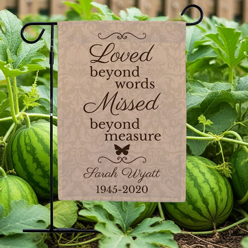 Loved beyond words personalized memorial garden flag with butterfly design displayed in watermelon patch