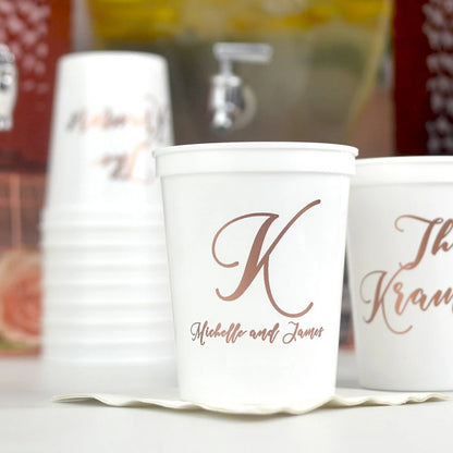 White color wedding stadium cups personalized with large initial K and bride and groom name in copper print
