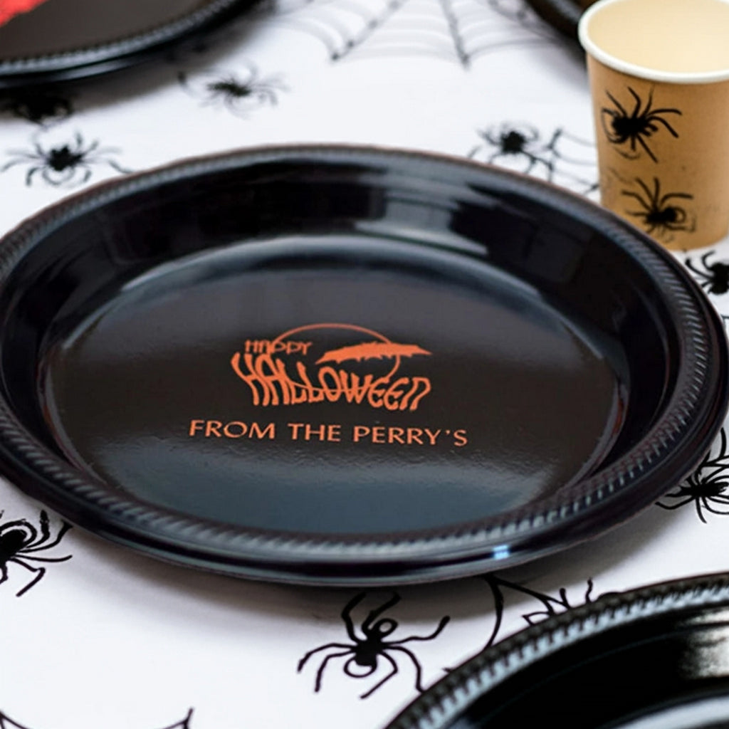 Black plate with orange Happy Halloween From the Perrys text on spider table personalized 10 inch plastic halloween dinner plates