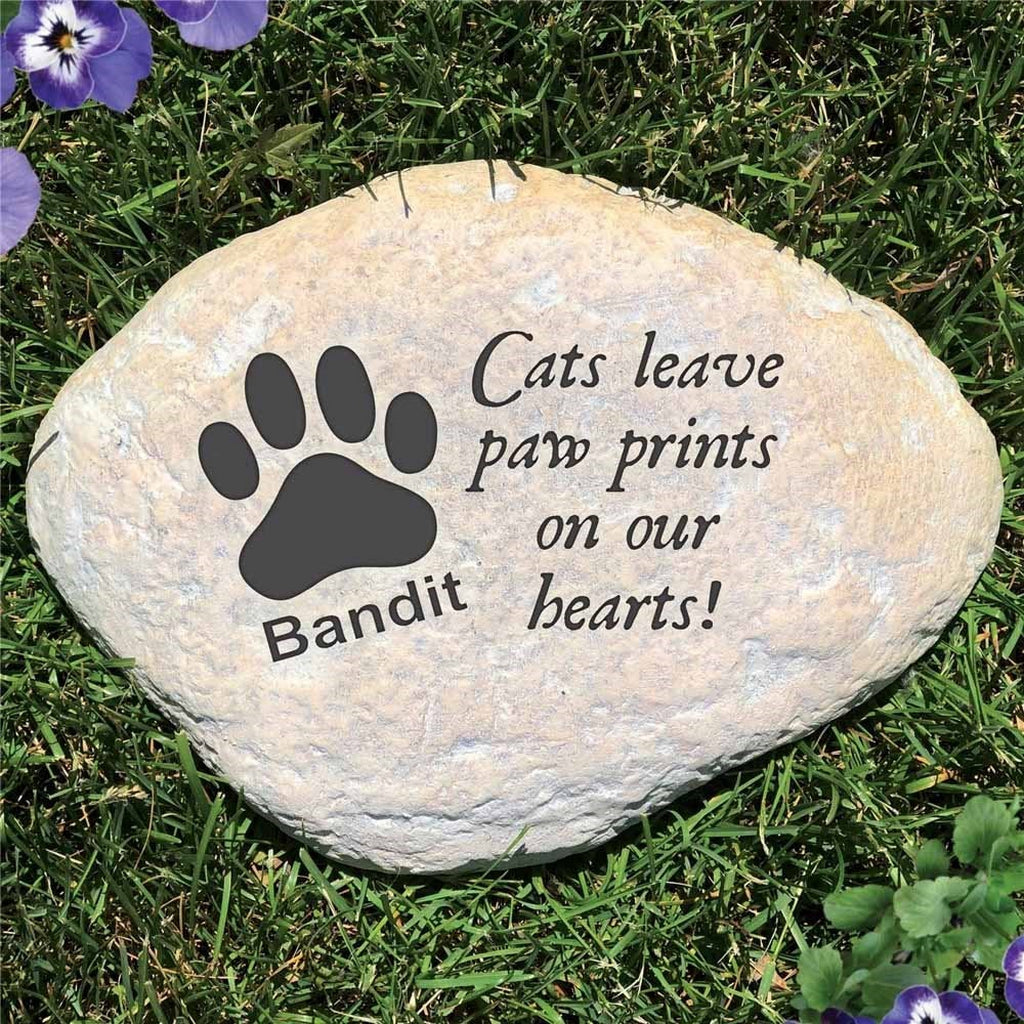 Personalized cat memorial garden stone with paw print and bandit text on grass