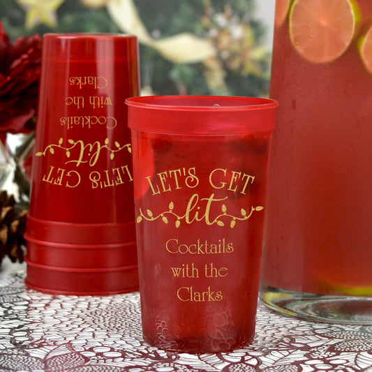 Red personalized christmas party stadium cups with gold holiday text for festive drinks