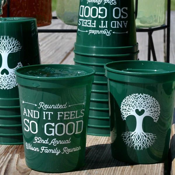 Green personalized family reunion cups with white tree design and custom reunion text for outdoor gatherings