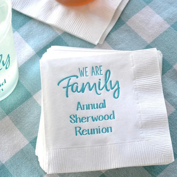 white family reunion 3-ply paper cocktail napkins personalized with we are family design and custom text in light blue print
