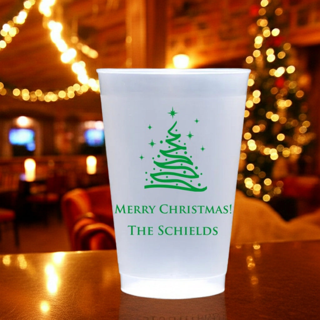 Personalized frosted plastic Christmas cups featuring a festive tree and holiday greetings
