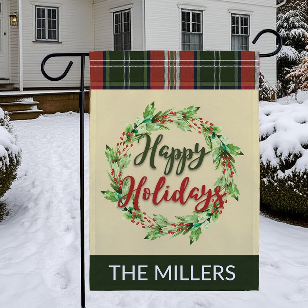 Personalized garden flag featuring a holiday wreath design with the name The Millers in festive colors