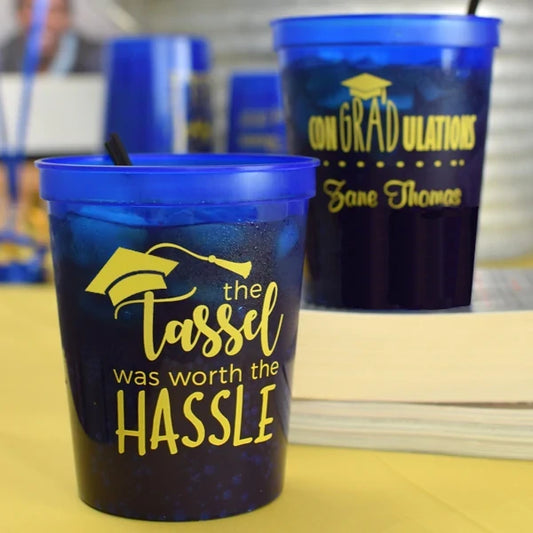 Translucent blue graduation stadium cups personalized with tassel hassle design in yellow print