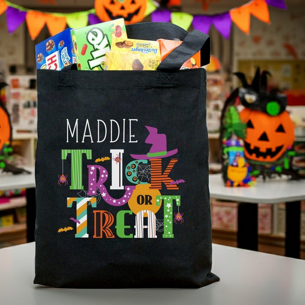 Personalized halloween candy bag with Maddie name and colorful Trick or Treat design filled with candy