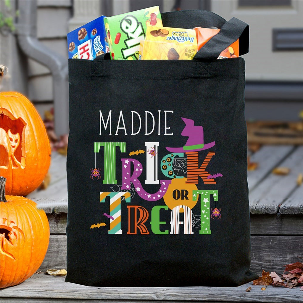 Personalized halloween candy bag black tote with colorful Maddie Trick or Treat design and candy inside