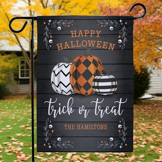 Halloween garden flag personalized with three patterned pumpkins Happy Halloween trick or treat and family name