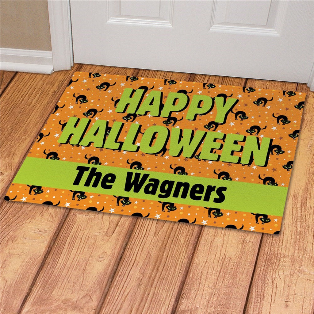 Personalized happy halloween doormat with green text and black cat design