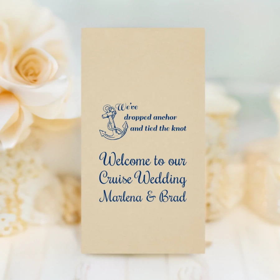 caramel color linen look displosable guest hand towel personalized with anchor wedding design and 3 lines of text in navy print on restroom vanity top