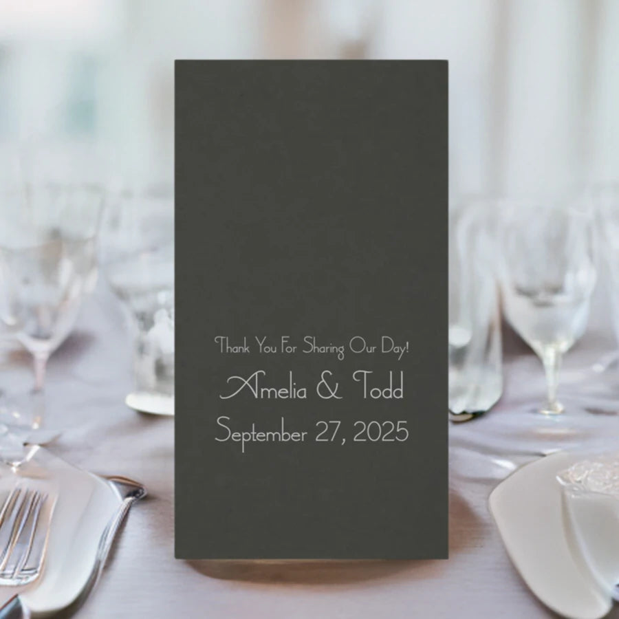 umbra grey color disposable linen feel guest towel personalized with 3 lines of custom text in silver print on wedding dinner table