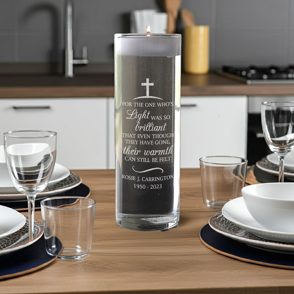 Personalized memorial candle vase with engraved cross and tribute text by Pro Gift Source on dining table