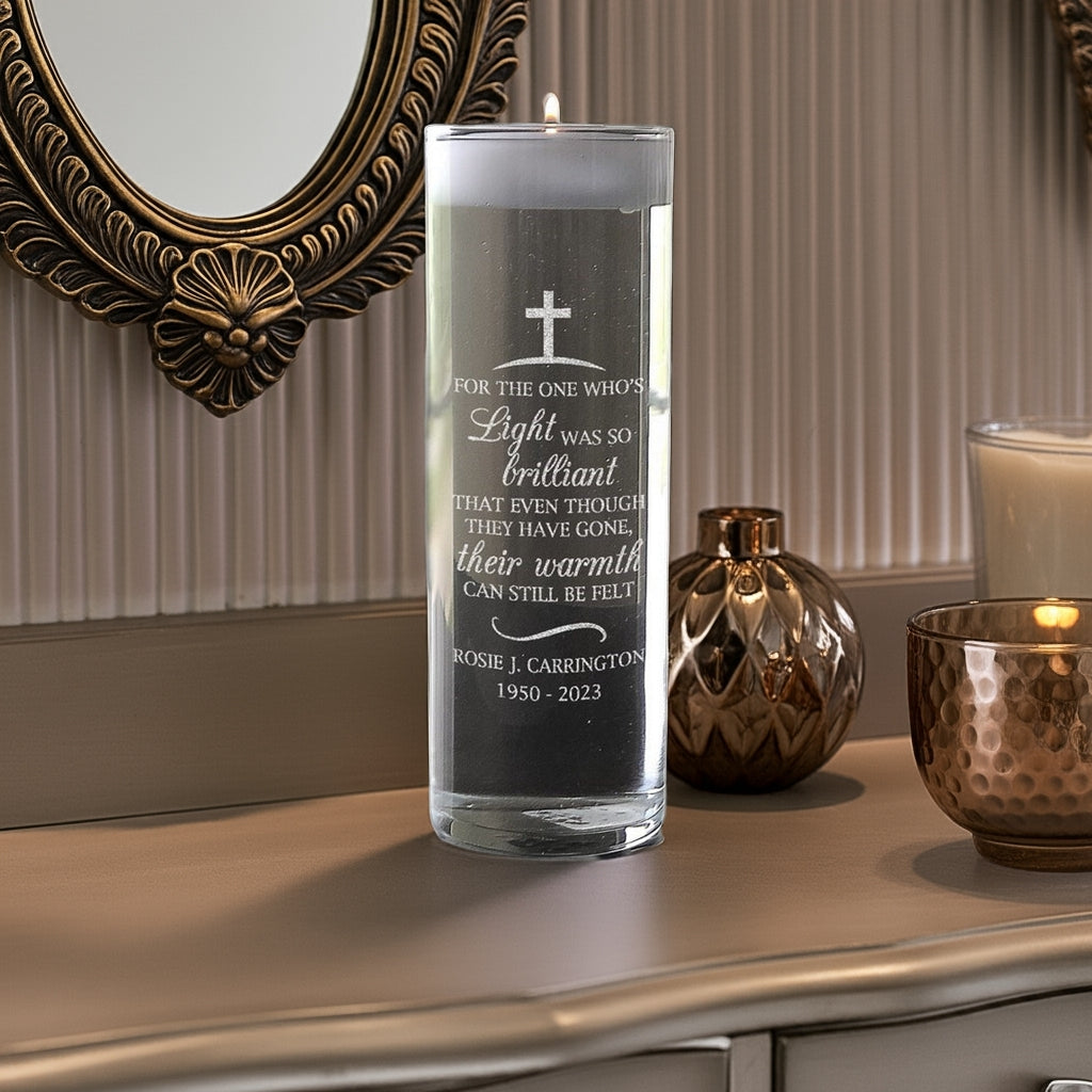 Personalized memorial candle vase with a heartfelt engraved message and cross design on a wooden surface