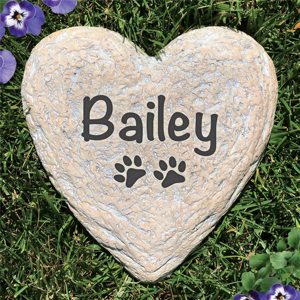 Heart-shaped garden stone personalized pet memorial stone with name Bailey and paw prints