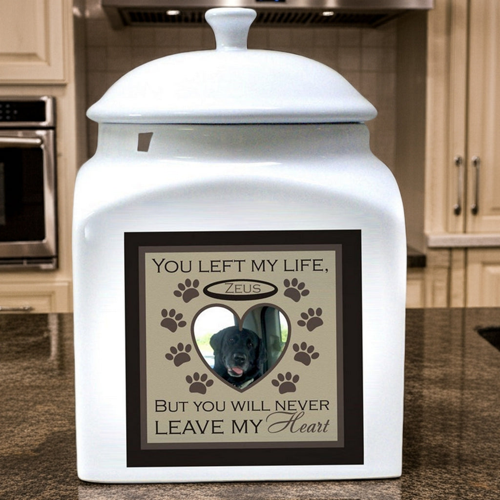 Personalized white ceramic pet urn with custom heart-shaped photo and paw print design