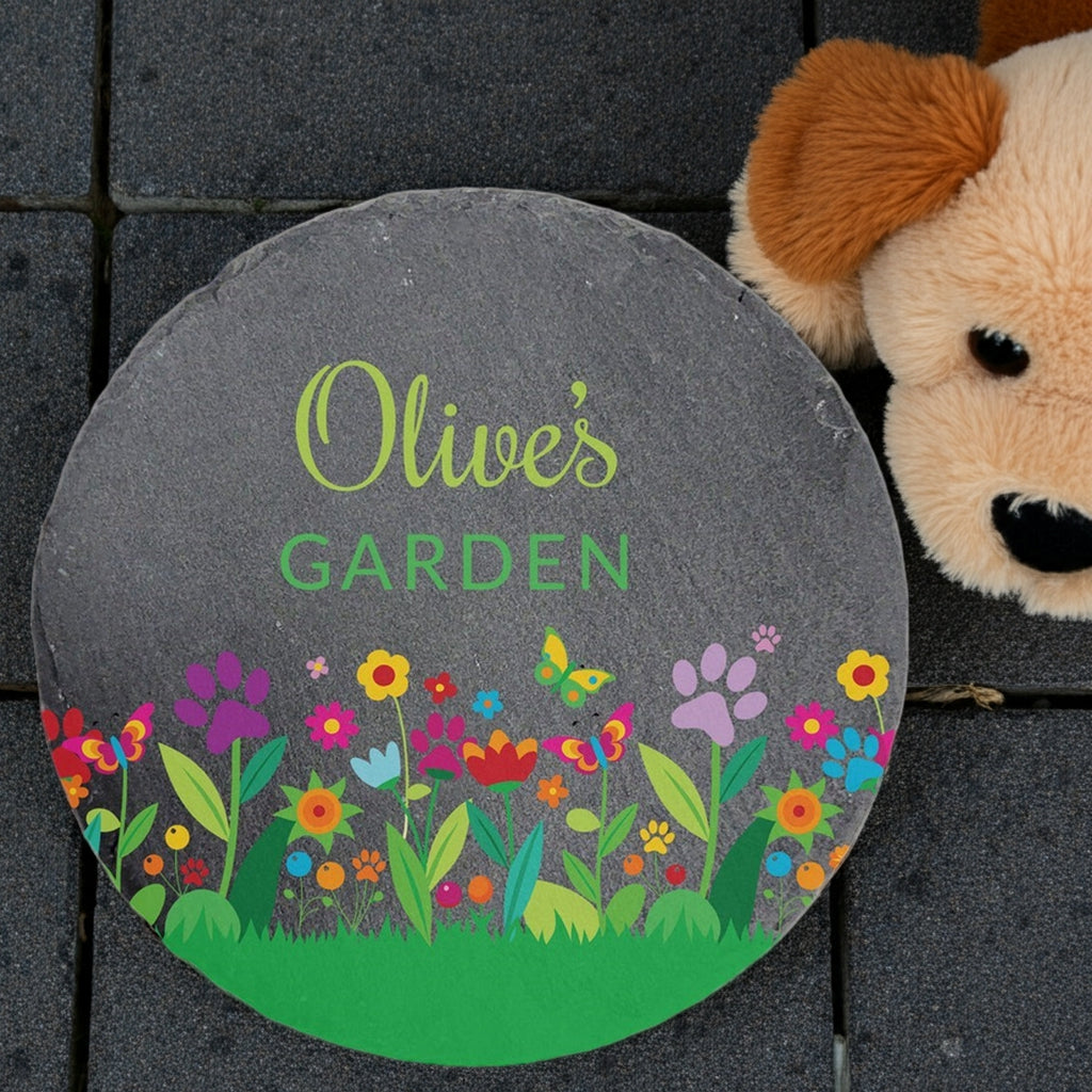 Personalized round slate pet memorial garden stone with colorful floral design and green text on slate
