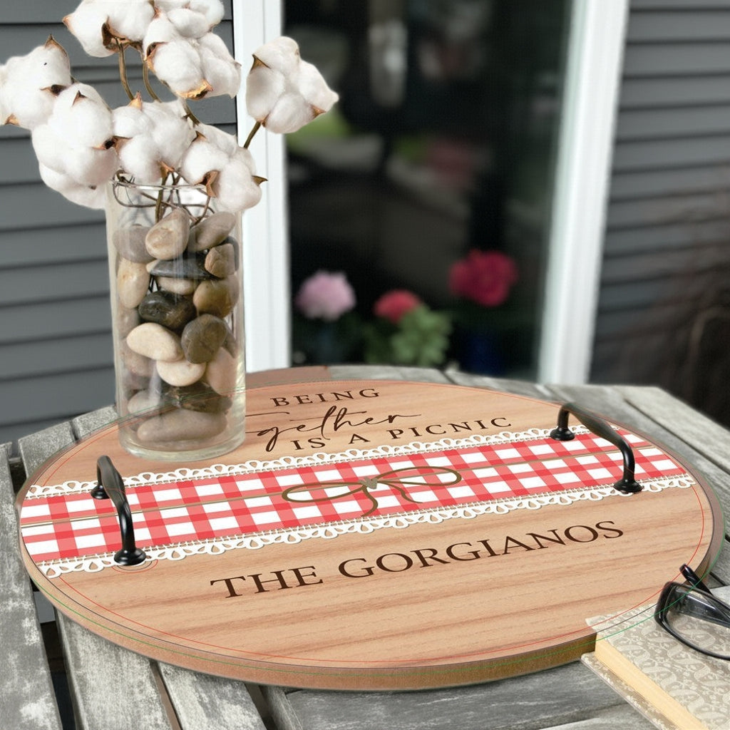 Personalized serving tray with picnic design and custom family name on wooden surface with handles