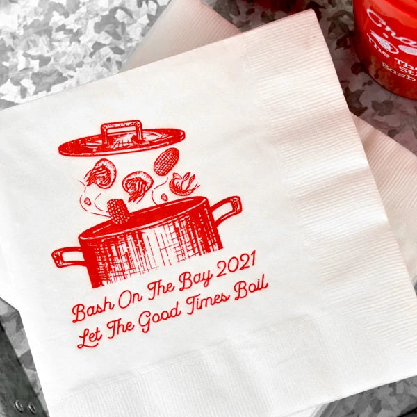 White summer party luncheon napkins personalized with crawfish boil design and 2 lines of text in red print